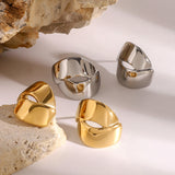 Aretes con abertura entrelazada