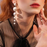 Aretes largo de perlas