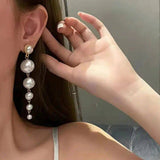 Aretes largo de perlas