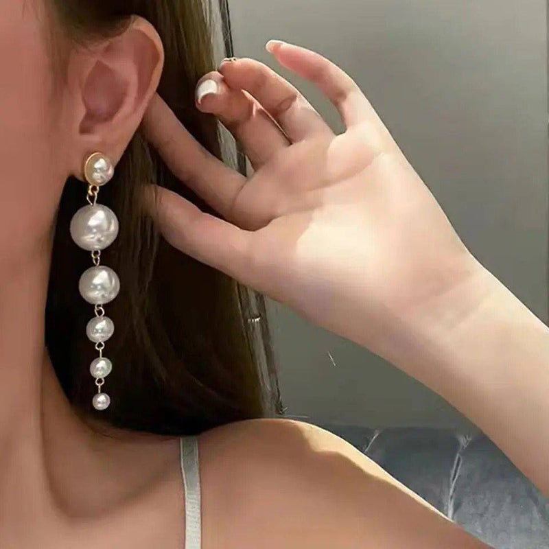 Aretes largo de perlas