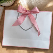 Bolsa de regalo elegante con listón
