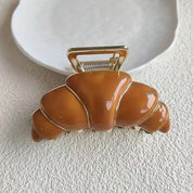 Gancho para cabello en forma de croissant