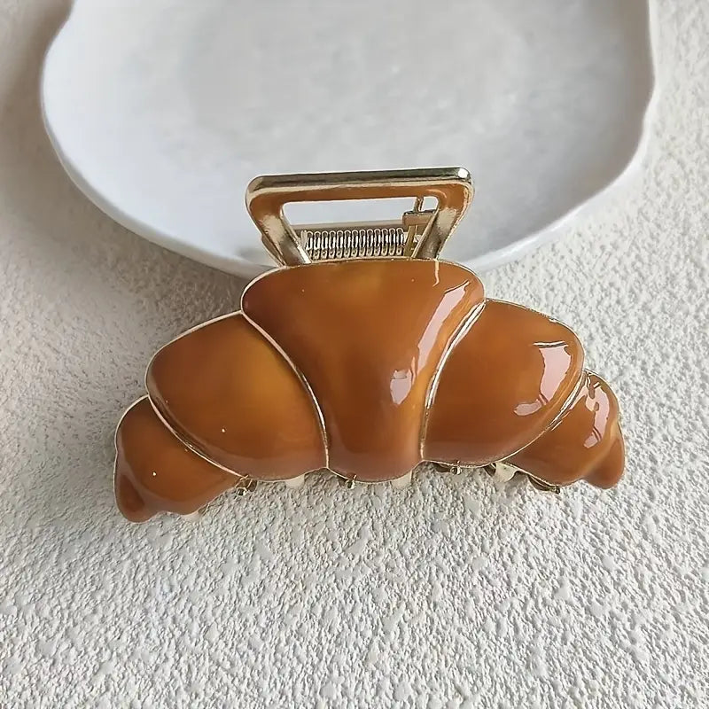 Gancho para cabello en forma de croissant